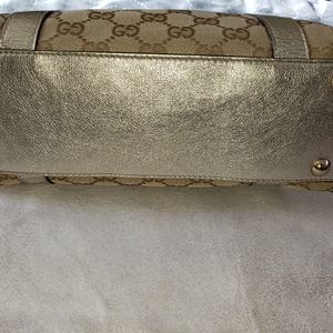 Gucci GG Abbey bag with metallic gold trim